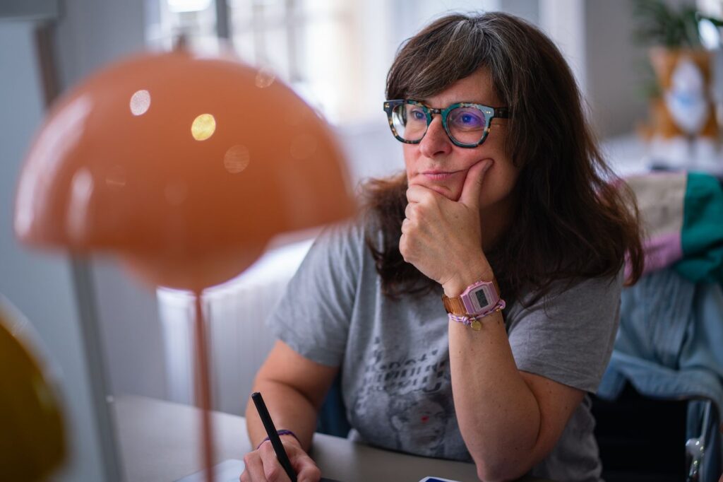 A team member deep in thought at her desk