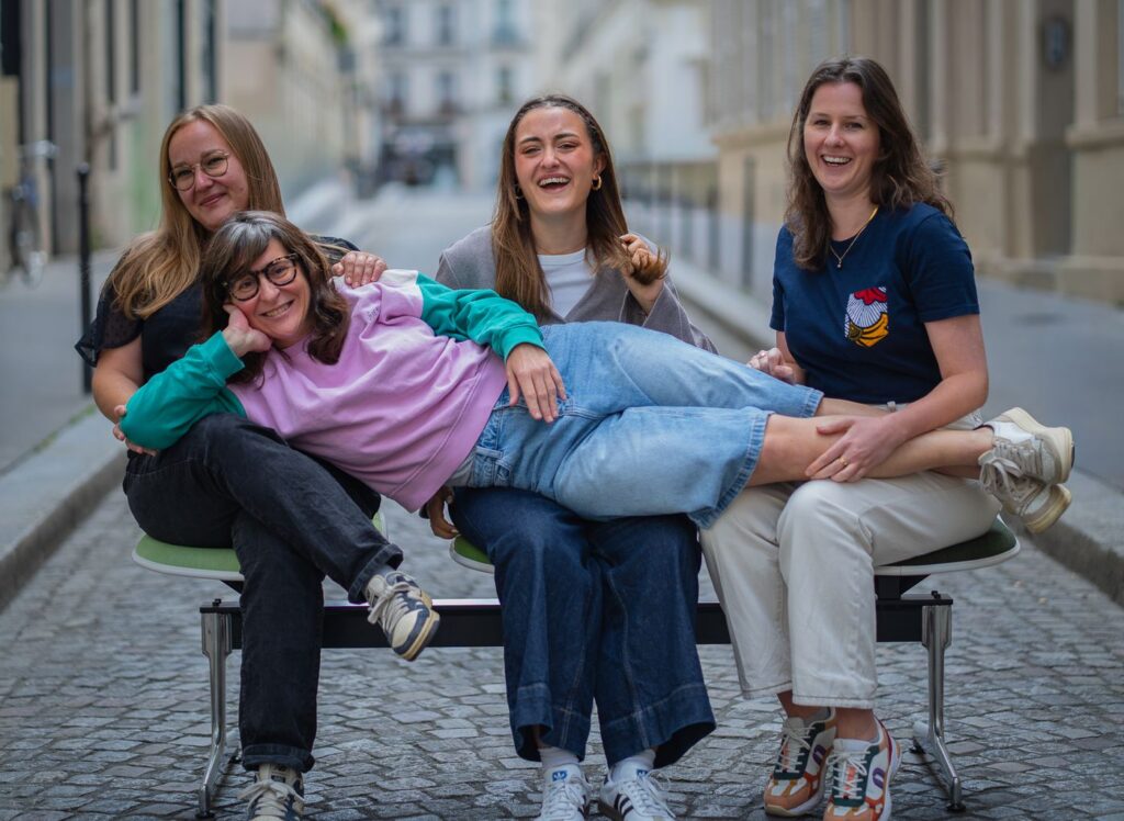 The Trapèze team striking a playful pose in the street
