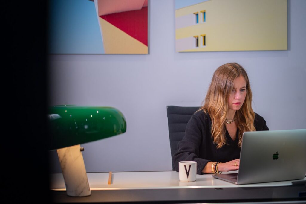 Vanessa Angeloglou, director of the Trapèze agency, at her desk